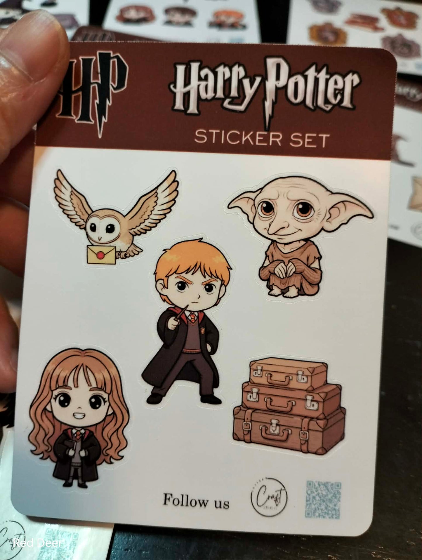 Harry Potter sticker set on a card held by a hand