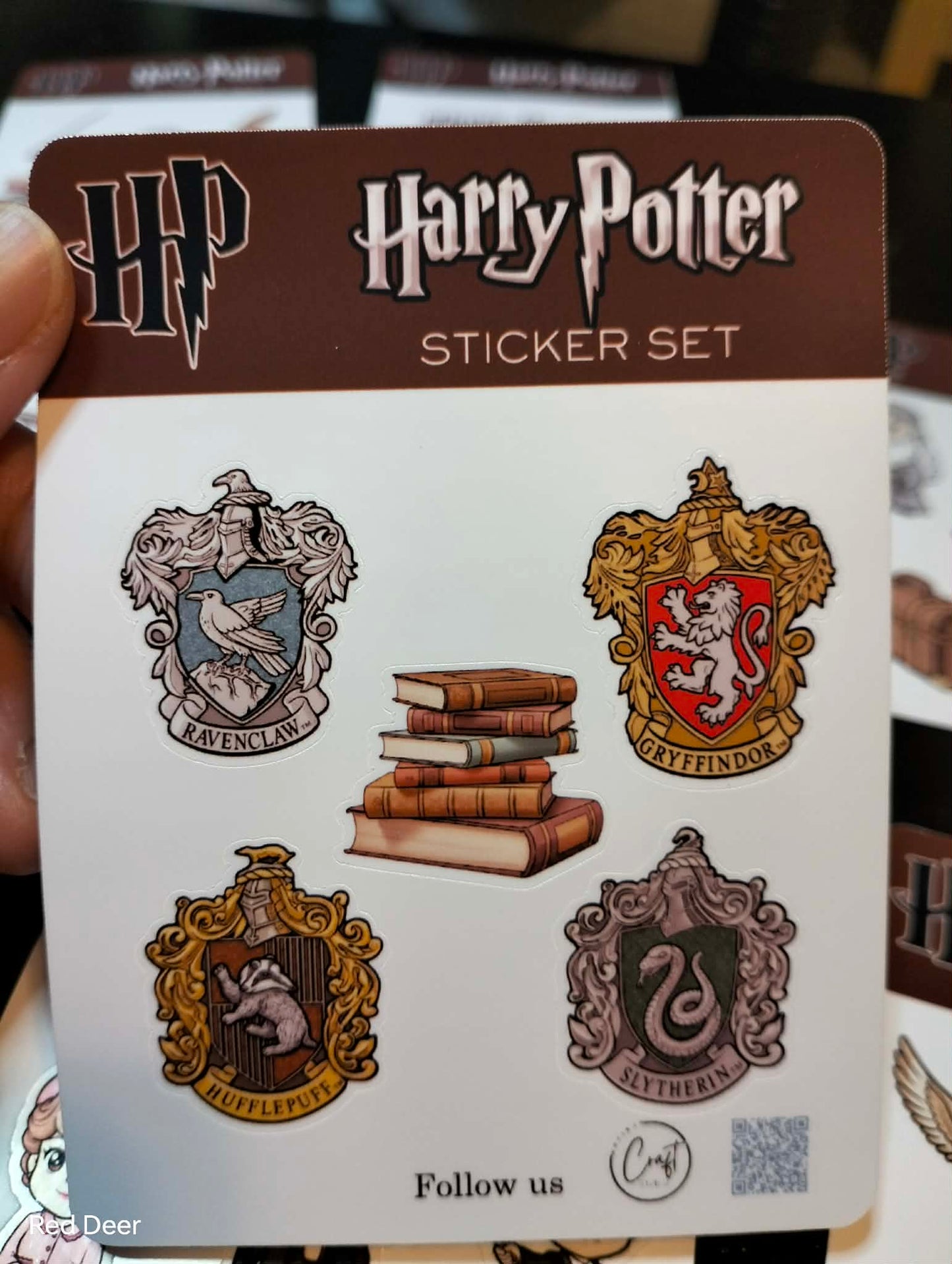 Harry Potter sticker set with Hogwarts houses logos on a card